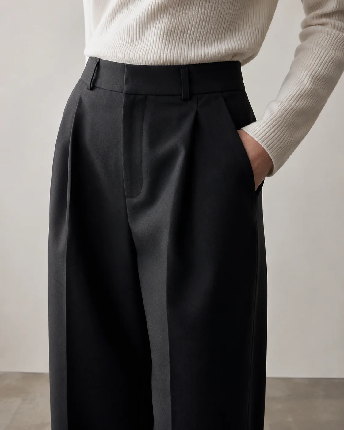 Black tailored trouser waistband and fit detail